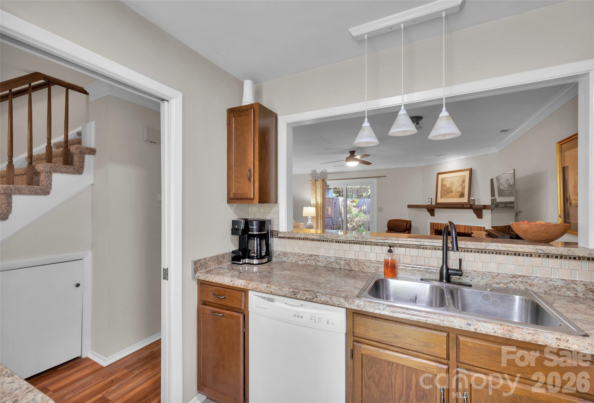 Kitchen looking out over Breakfast Bar to Great Room - 9004-C Nolley Court, Charlotte