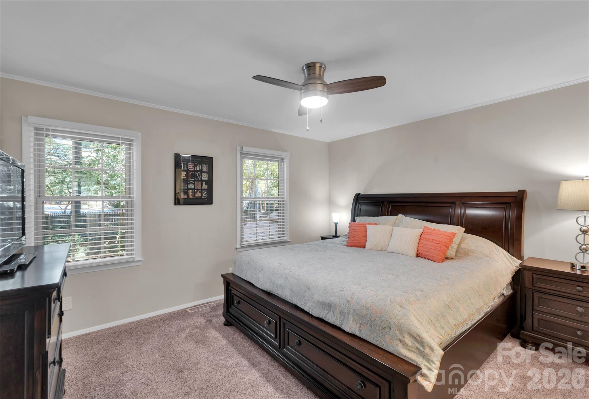 Primary Bedroom overlooking patio and wooded area behind home - 9004-C Nolley Court, Charlotte