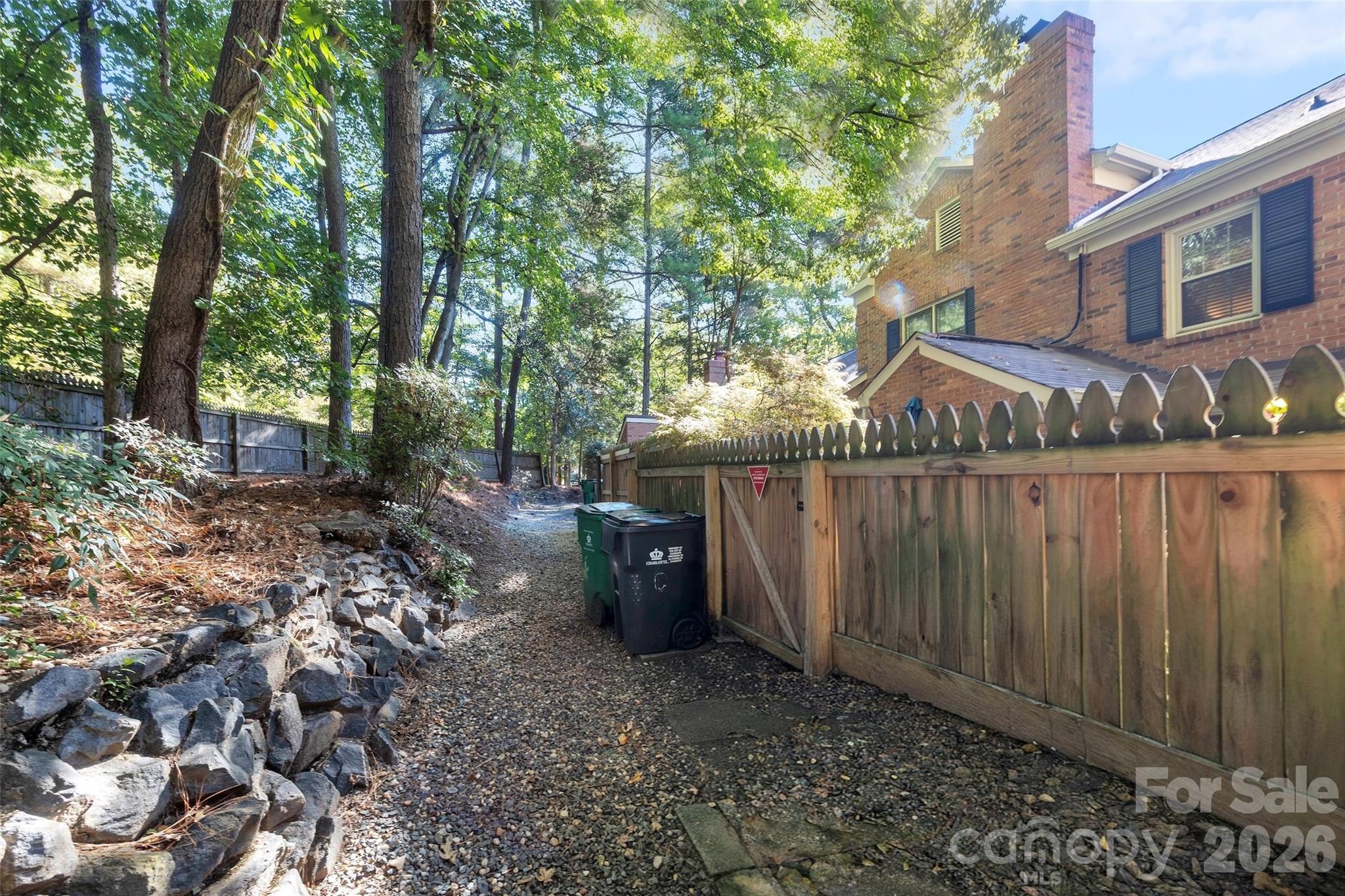Walkway Behind Units for wheeling trash cans to street and for access to sidewalks - 9004-C Nolley Court, Charlotte