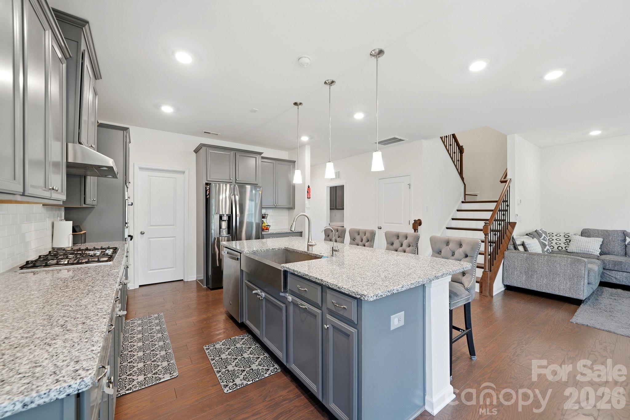 Beautiful kitchen with farm house sink, granite counter tops, SS appliances and open floor plan - 4603 Monument Valley Drive, Indian Land