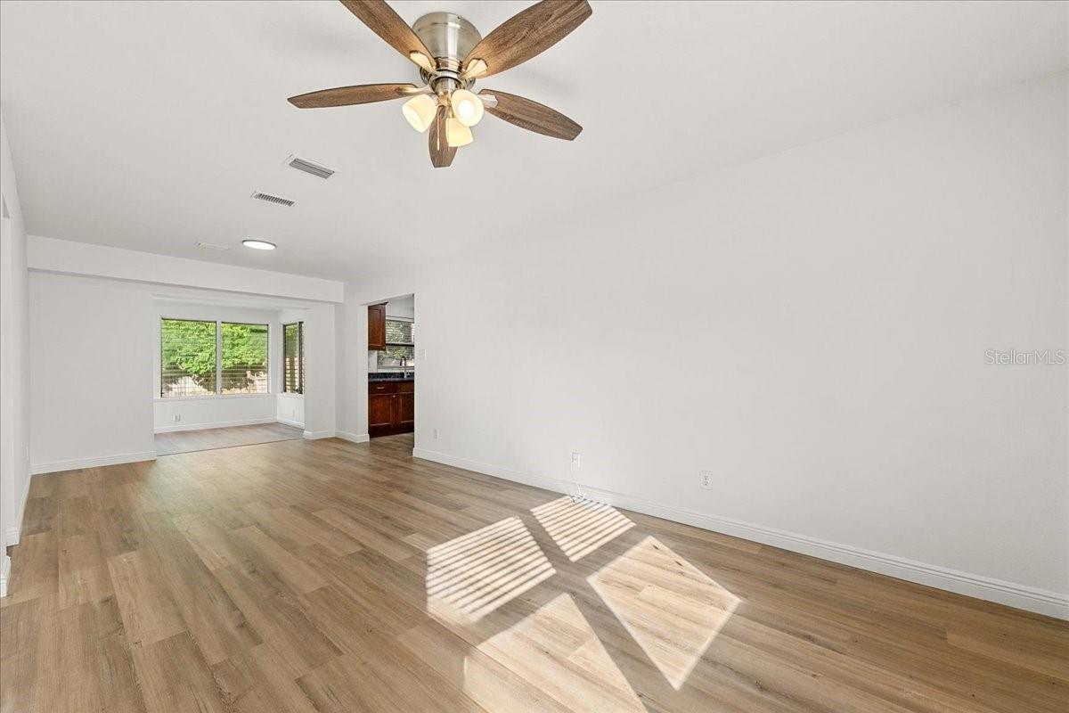 Living room toward sunroom - 711 14TH ST, PALM HARBOR