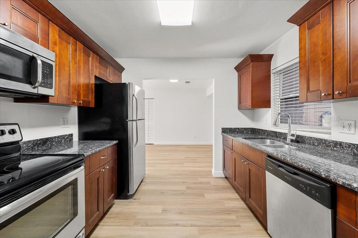 Kitchen with stainless steel appliances - 711 14TH ST, PALM HARBOR