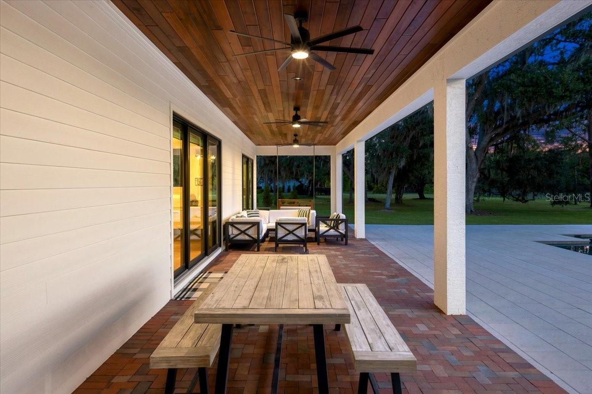 Rear Patio Twilight - 888 TWIN OAKS LN, WINTER HAVEN