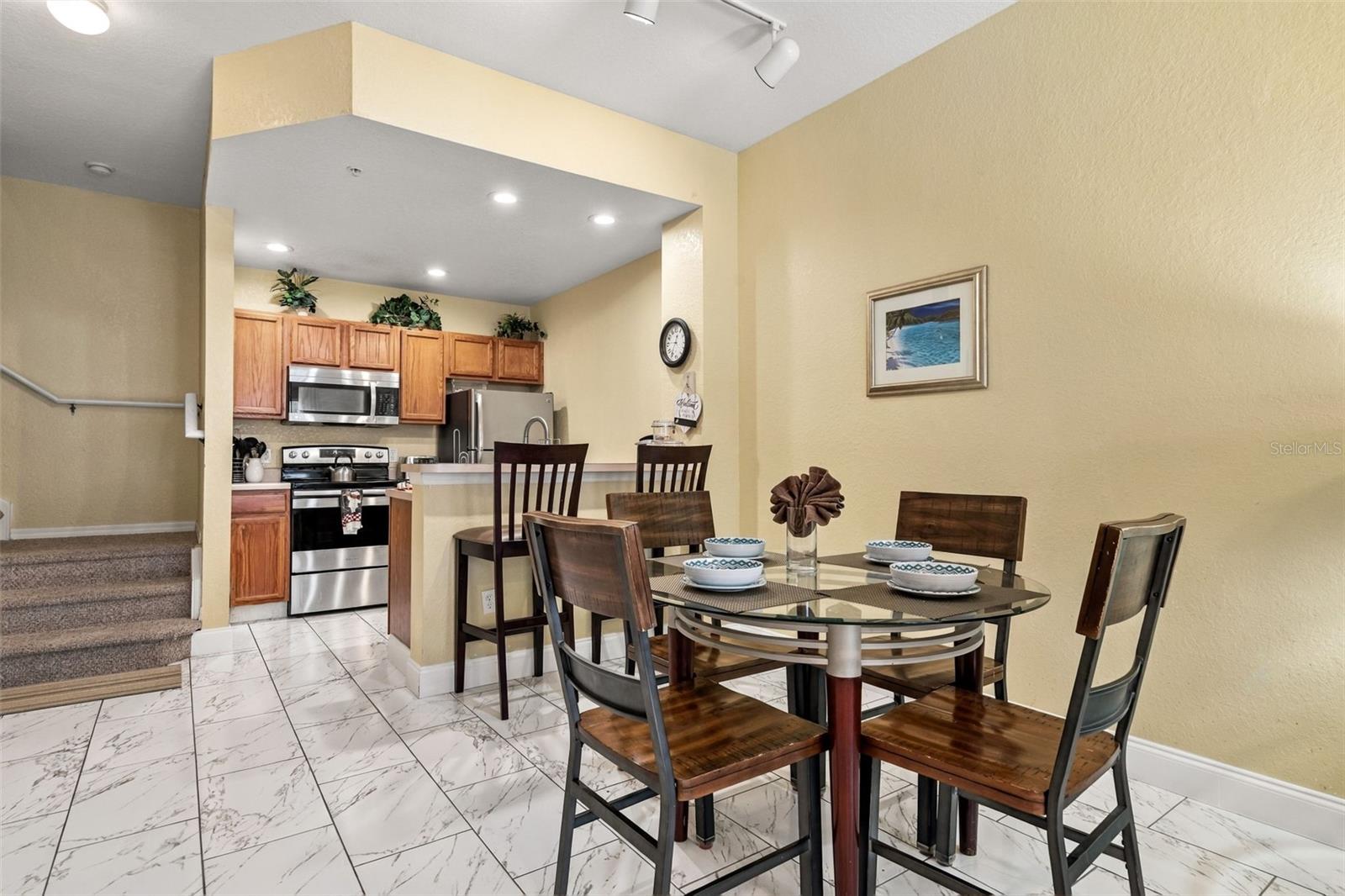 Dinning Area / Kitchen with high-top seating. - 4600 YELLOWGOLD RD W #105, KISSIMMEE