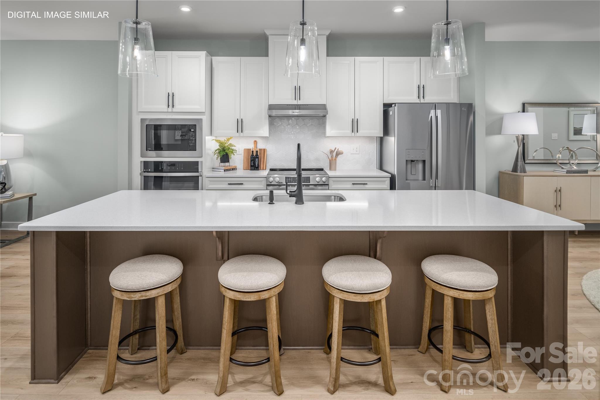 Oversized island with plenty of seating, perfect for gathering and everyday living. - 11237 Emerson Landing Drive, Charlotte
