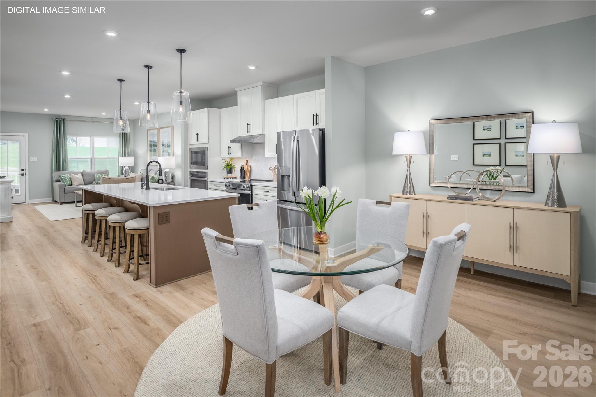 Open kitchen and dining space that flows easily for meals, hosting, and daily life. - 11237 Emerson Landing Drive, Charlotte