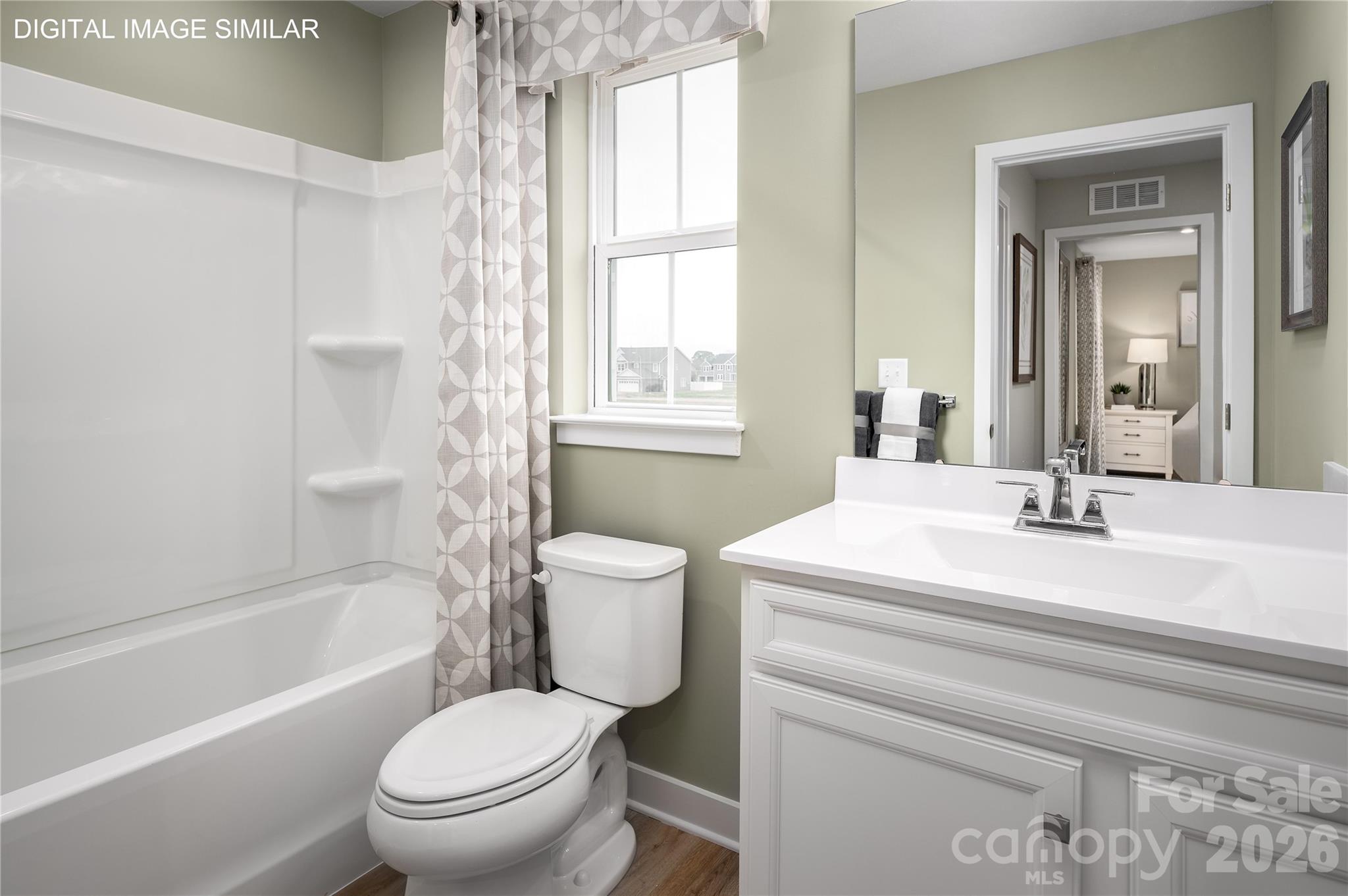 Inviting upstairs full bath with tub/shower combo—designed for both comfort and convenience. - 11237 Emerson Landing Drive, Charlotte