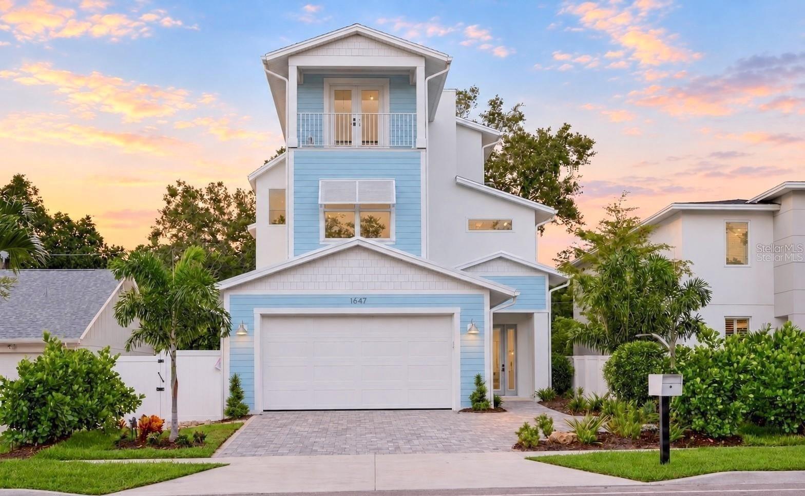 A gate enclosure has since been added for the front door pathway, to create more privacy - 1647 SIESTA DR, SARASOTA