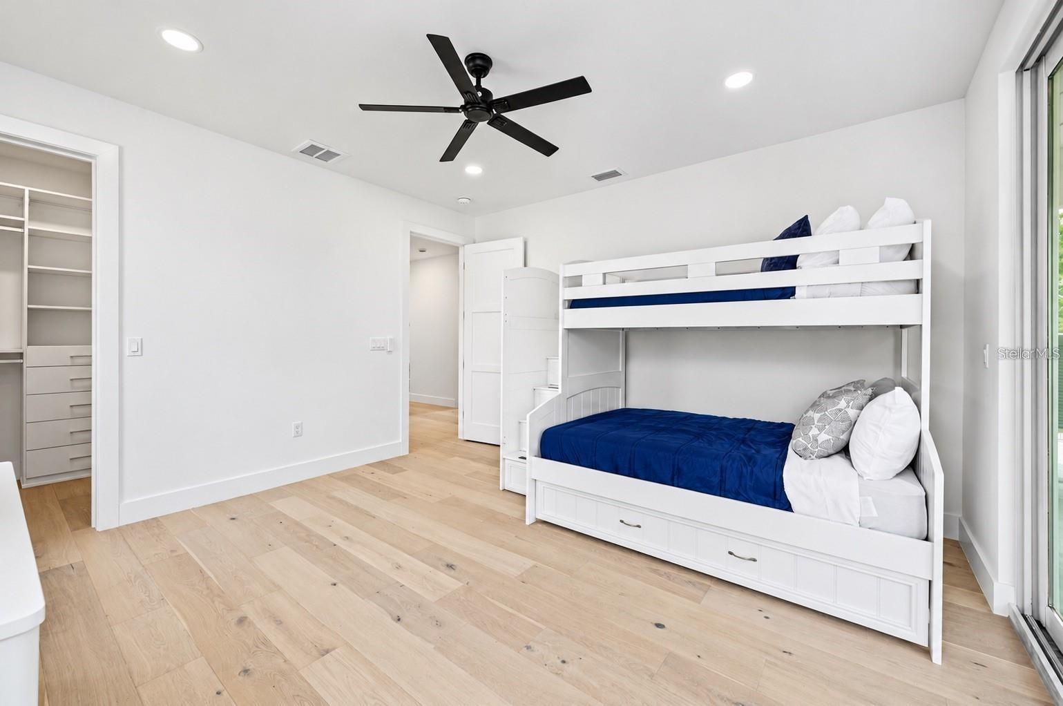 Guest bedroom, with access to the balcony that has the spiral staircase to the pool deck - 1647 SIESTA DR, SARASOTA