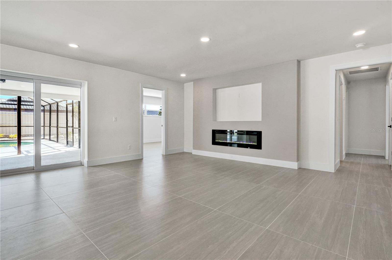Living room with fireplace - 915 60TH ST W, BRADENTON