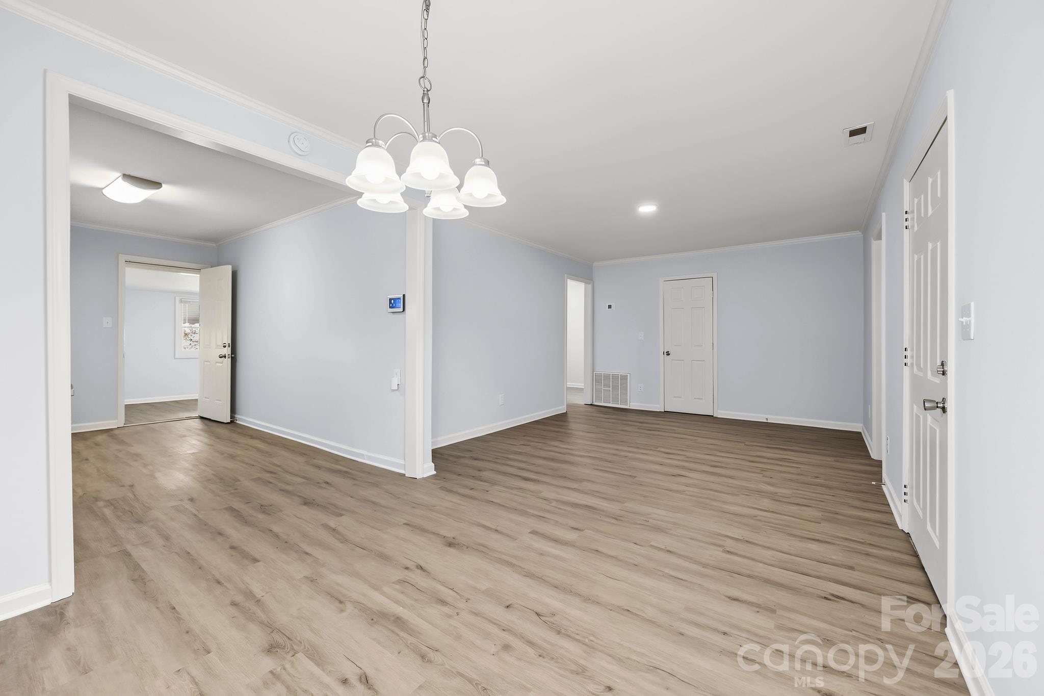 Large living room that opens to the dining area and kitchen - 2018 Quentin Street, Charlotte