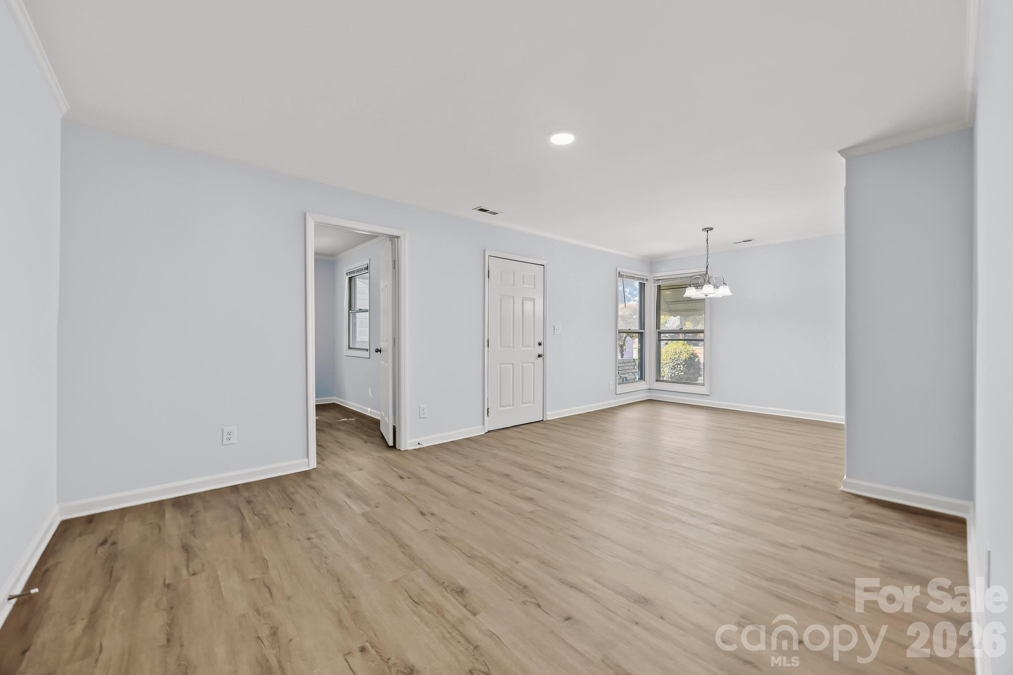 Large living room that opens to the dining area and kitchen - 2018 Quentin Street, Charlotte