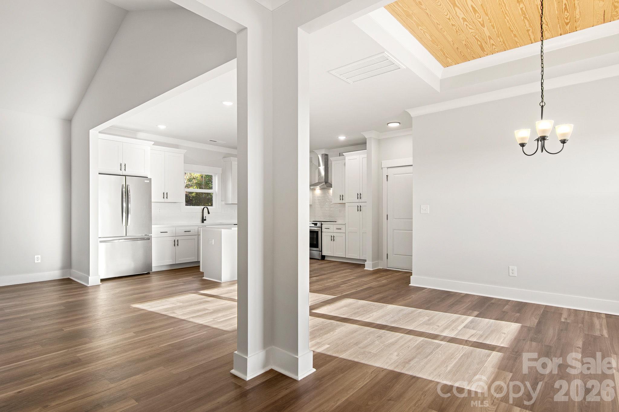 from front door though dining room and kitchen - notice inset wood ceiling - 4665 Riverside Road, Lancaster
