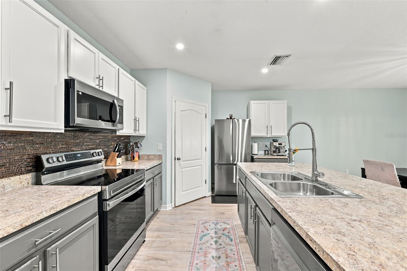 Kitchen with brand new appliances and walk-in pantry - 5213 11TH ST E, BRADENTON