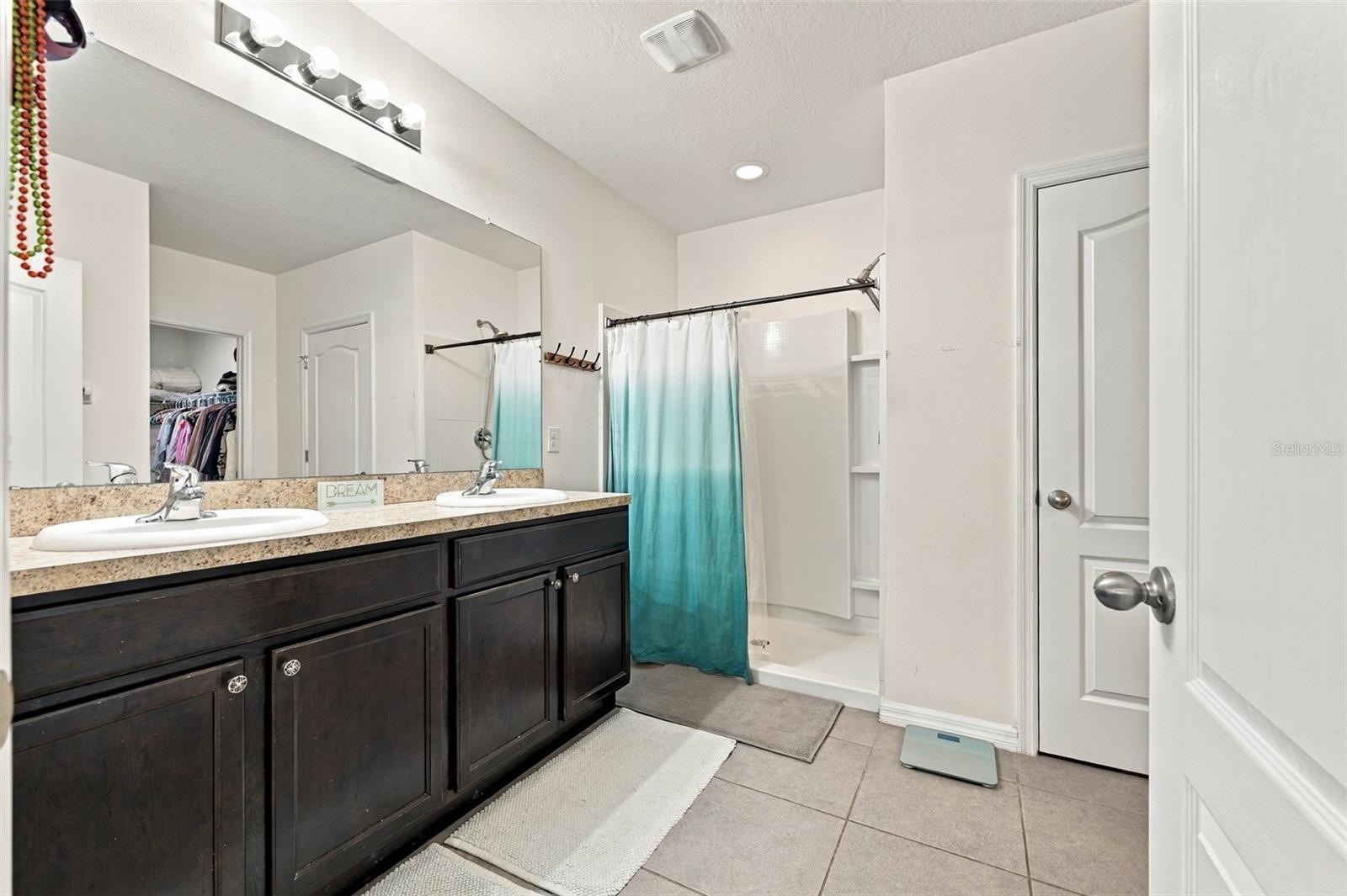 Primary bathroom with shower and 2-closets - 5213 11TH ST E, BRADENTON
