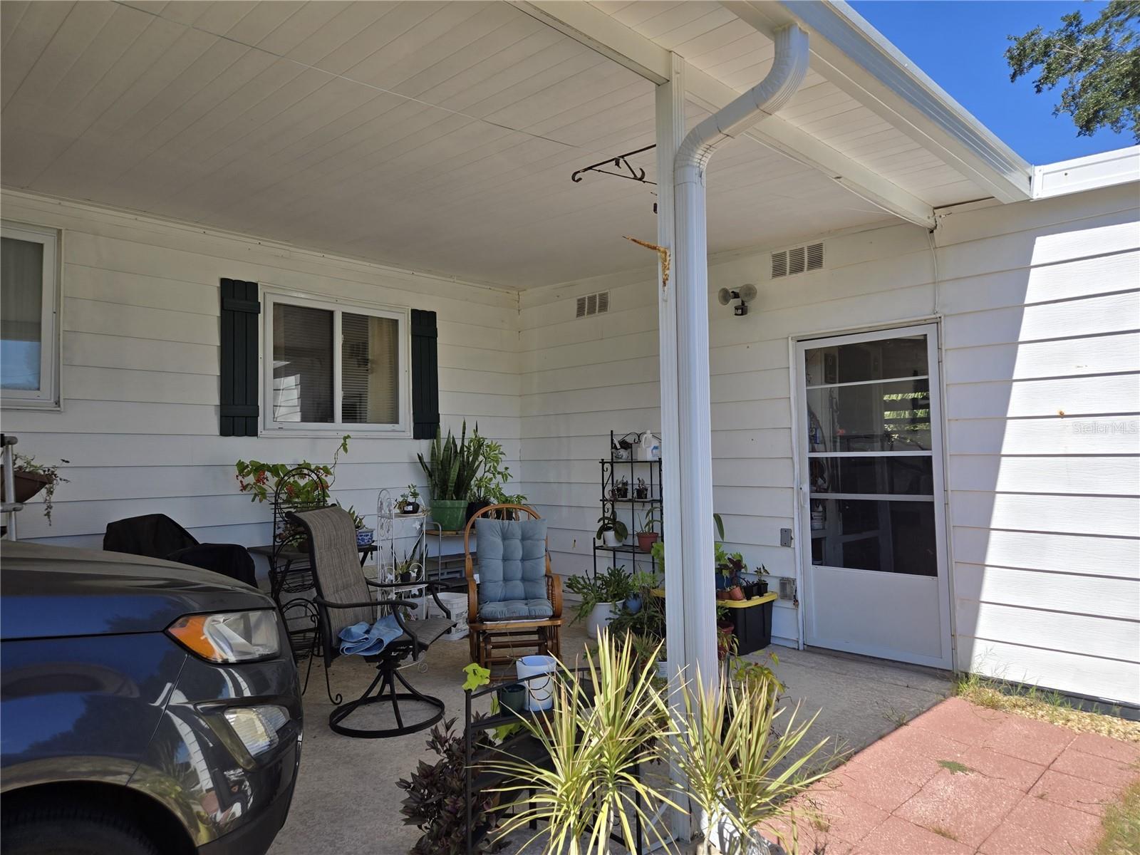 carport to laundry and storage - 3889 DIAMOND OAK WAY #493, ZELLWOOD
