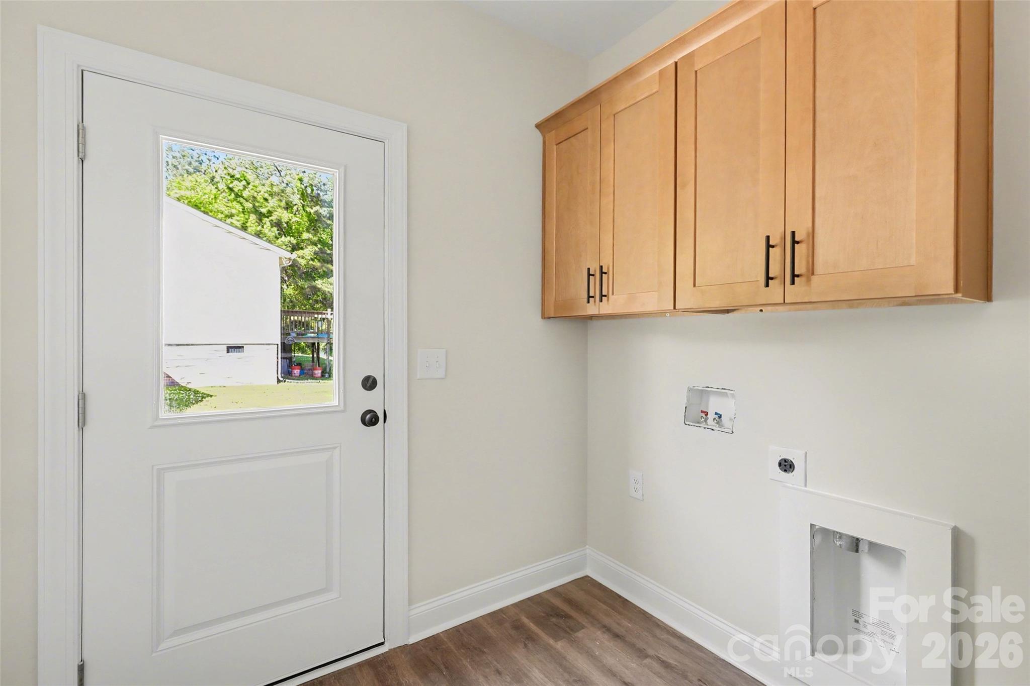 laundry room with additional cabinet storage - 1452 Robinwood Road, Gastonia