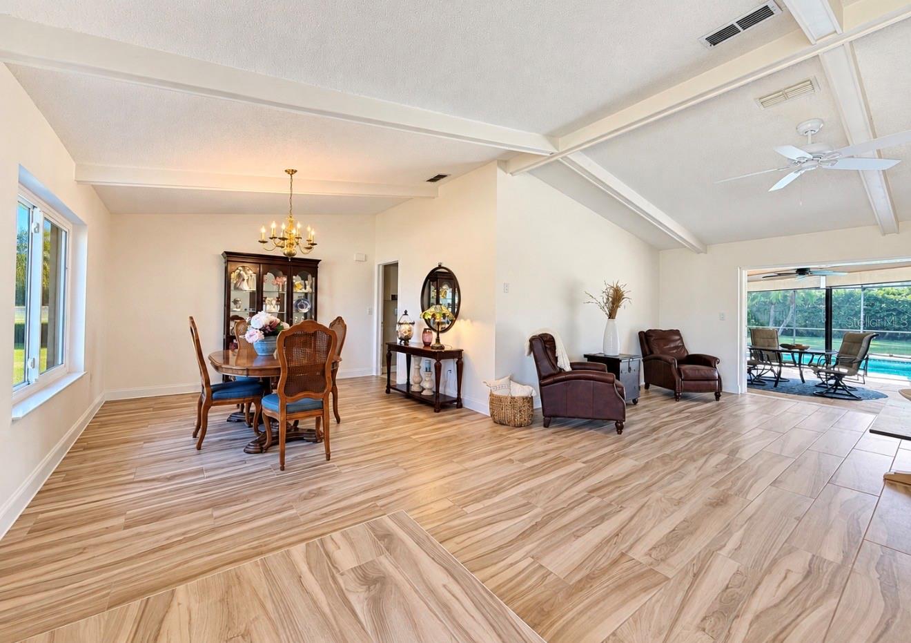 open dining living area leads to pool lanai - 9690 LEEWARD AVE, LARGO