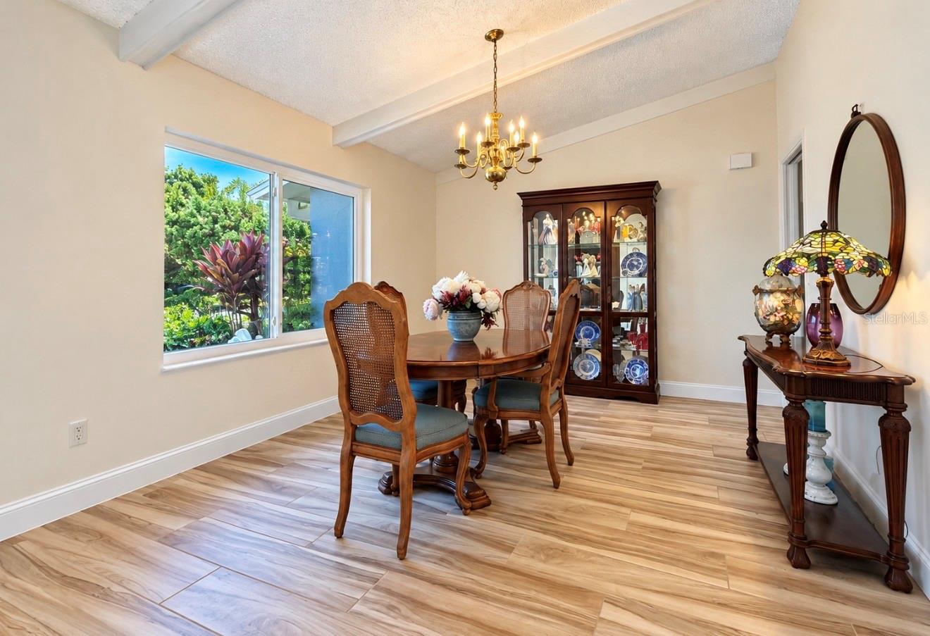 Dining room with large window - 9690 LEEWARD AVE, LARGO