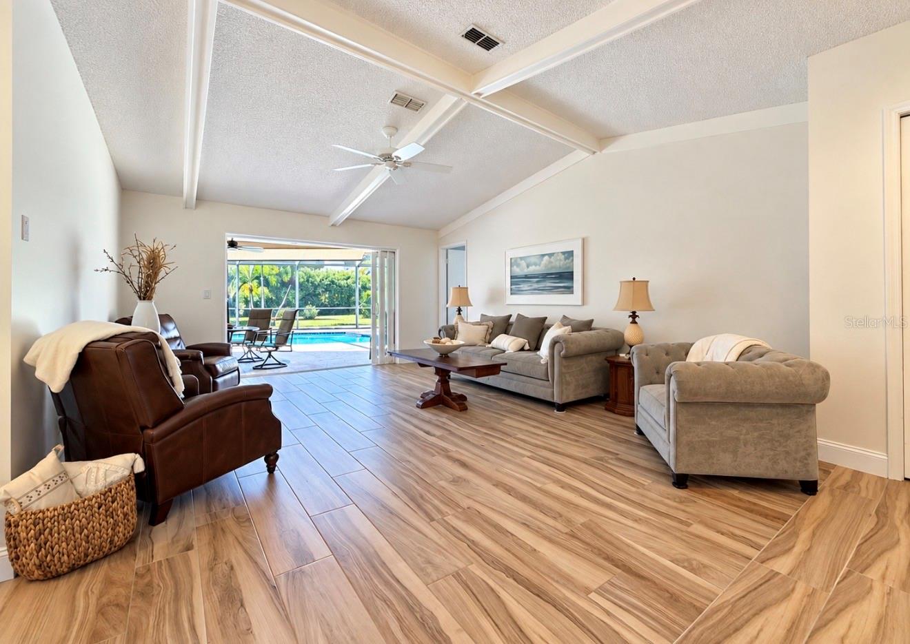 Living room to pool lanai - 9690 LEEWARD AVE, LARGO
