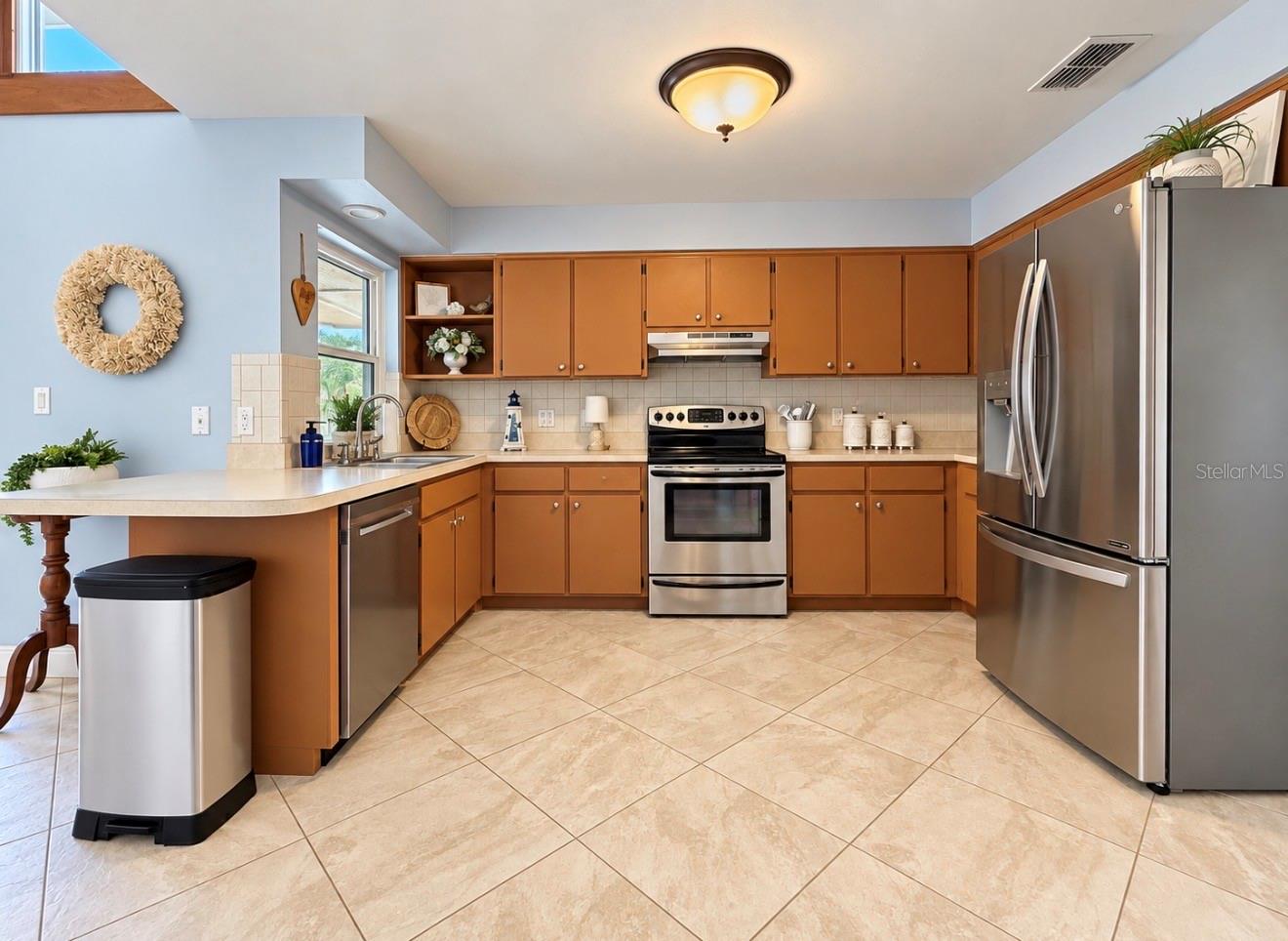 Kitchen with stainless steel appliances - 9690 LEEWARD AVE, LARGO