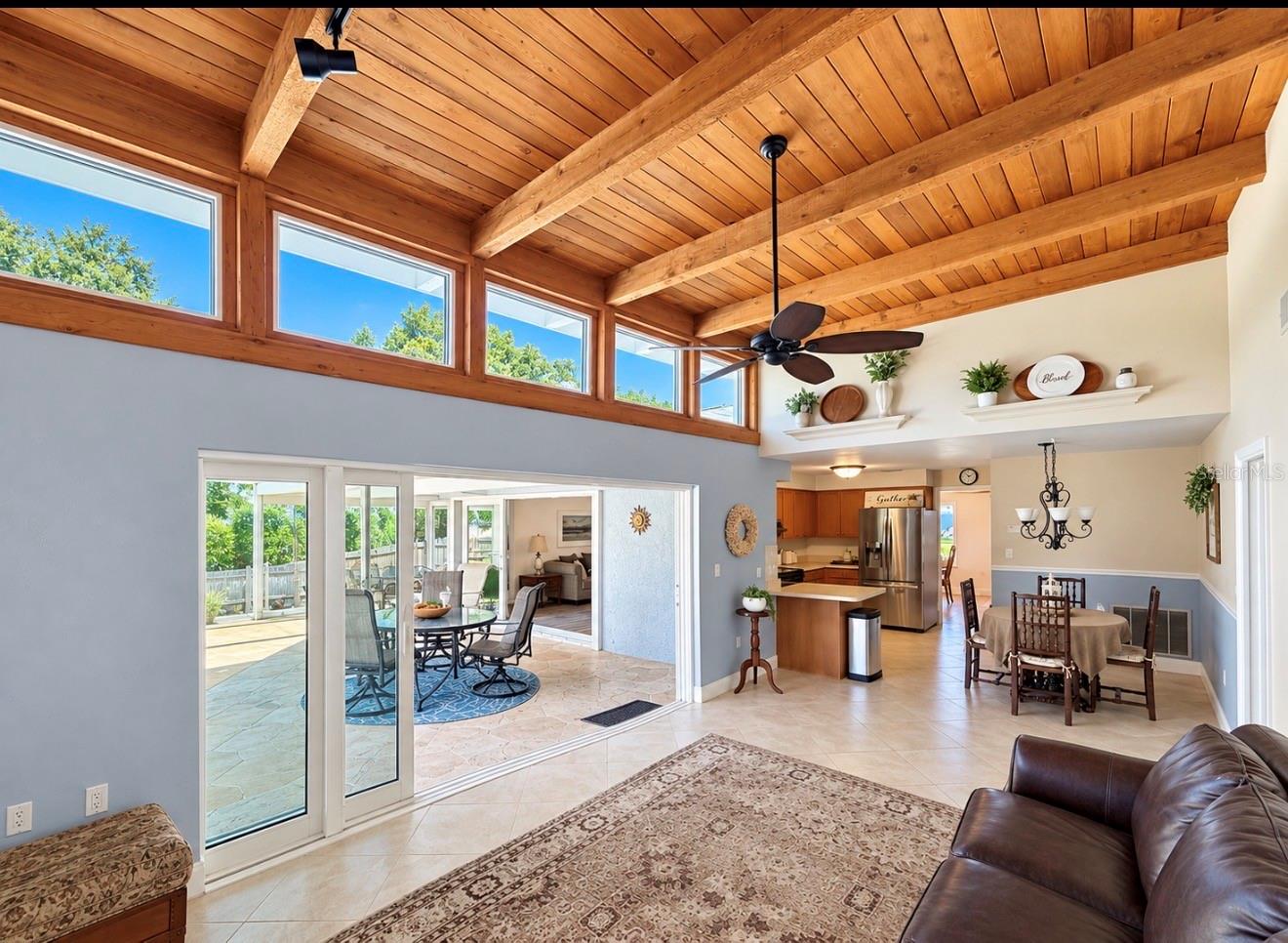 Family room opens to pool lanai - 9690 LEEWARD AVE, LARGO