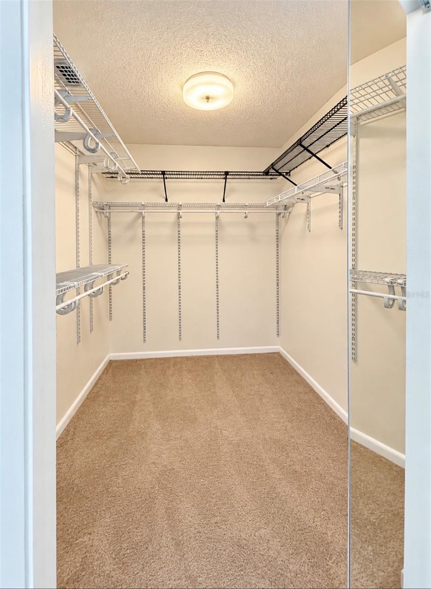 Primary walk-in closet - 9690 LEEWARD AVE, LARGO