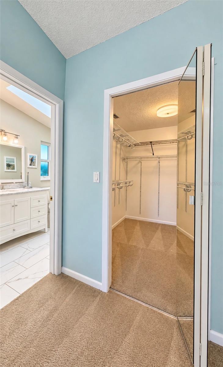 walk-in closet next to bathroom - 9690 LEEWARD AVE, LARGO