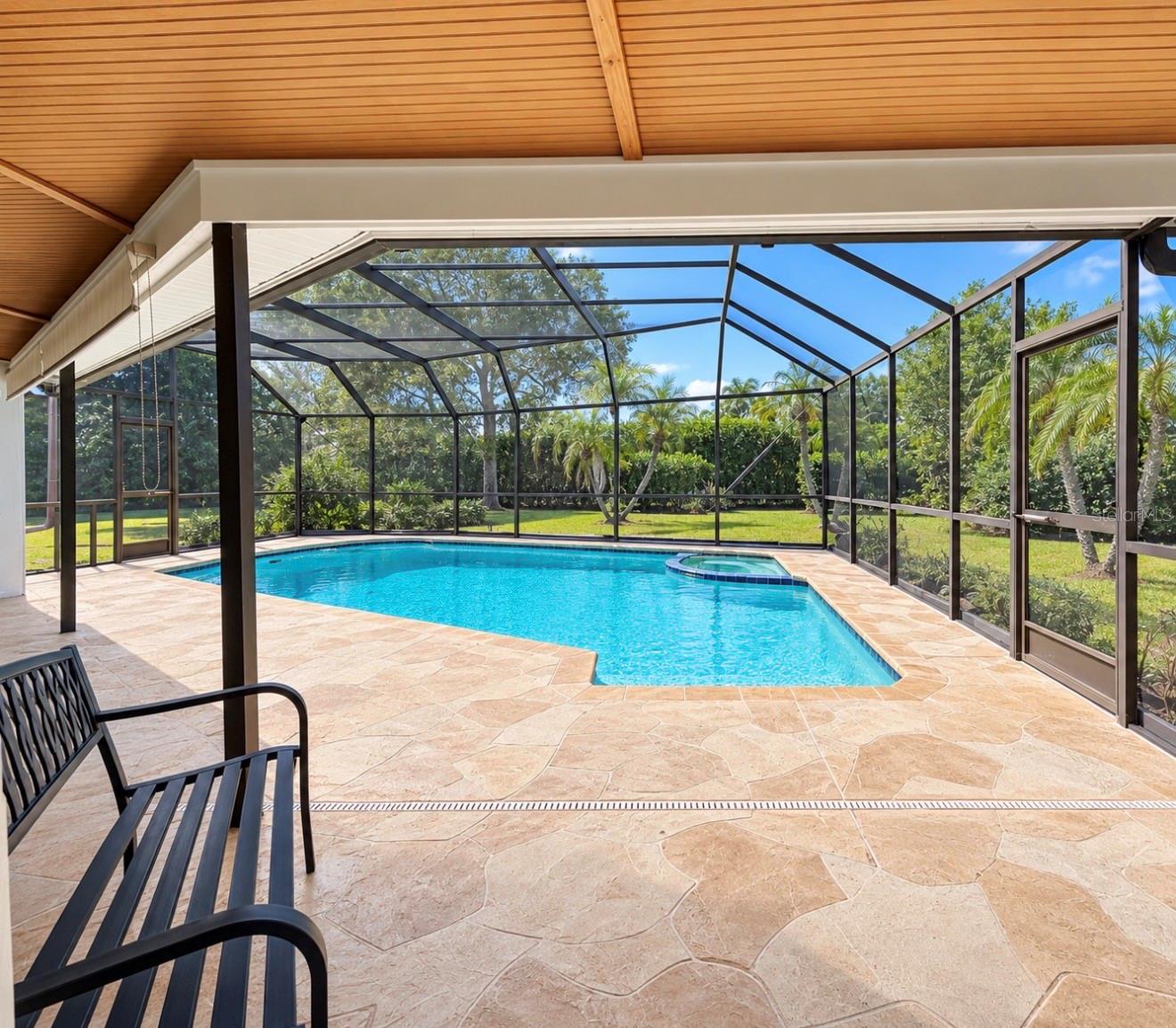 Pool covered lanai or primary bedroom - 9690 LEEWARD AVE, LARGO