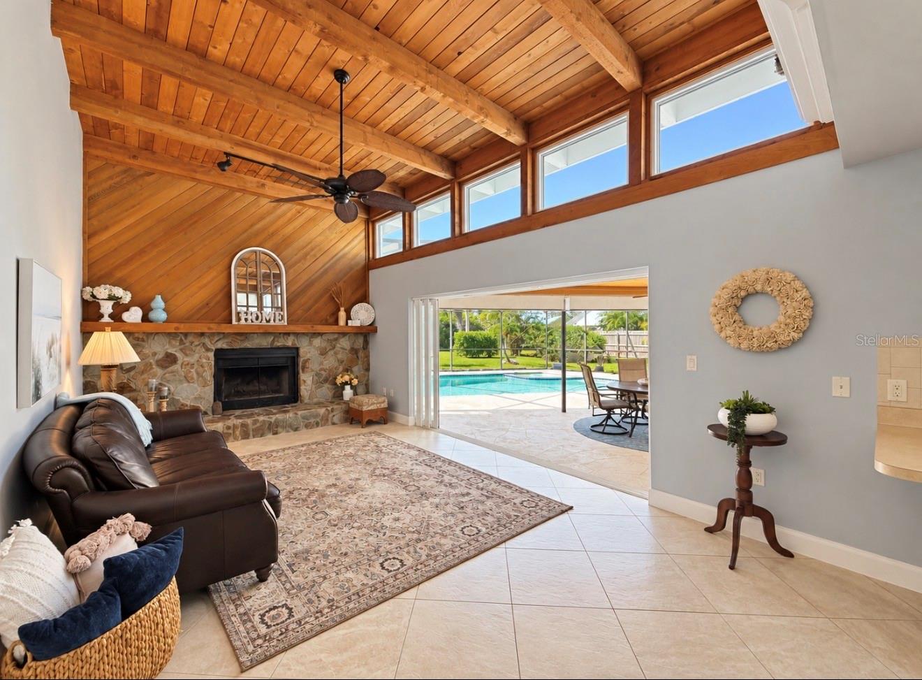 Family room looking out over pool lanai - 9690 LEEWARD AVE, LARGO
