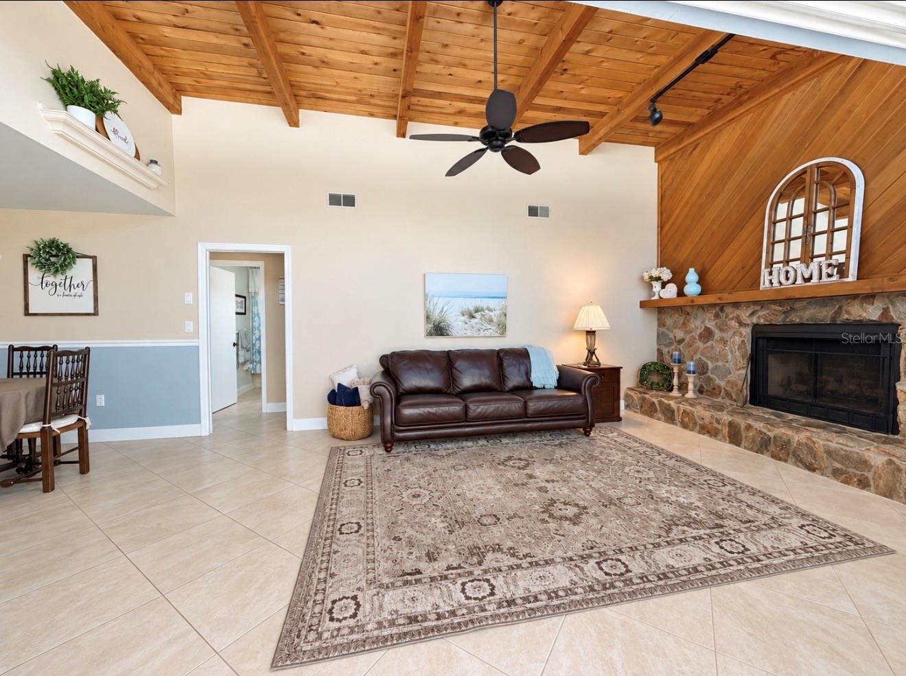 Family room with natural light and fireplace off 2nd and 3rd bedroom hallway - 9690 LEEWARD AVE, LARGO