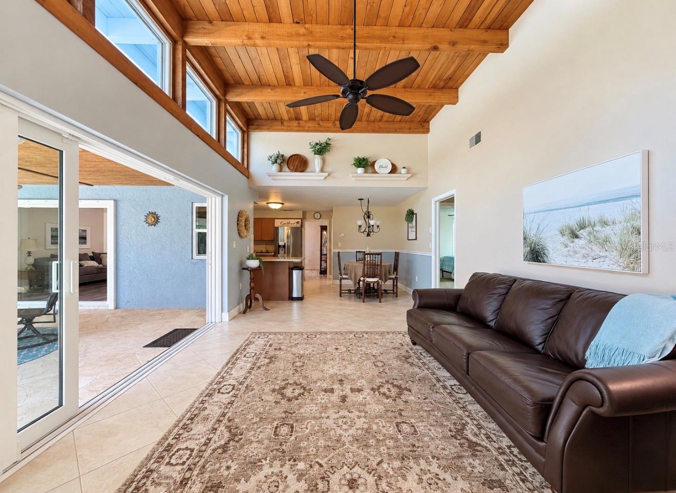 Family room with natural light and fireplace off 2nd and 3rd bedroom hallway - 9690 LEEWARD AVE, LARGO