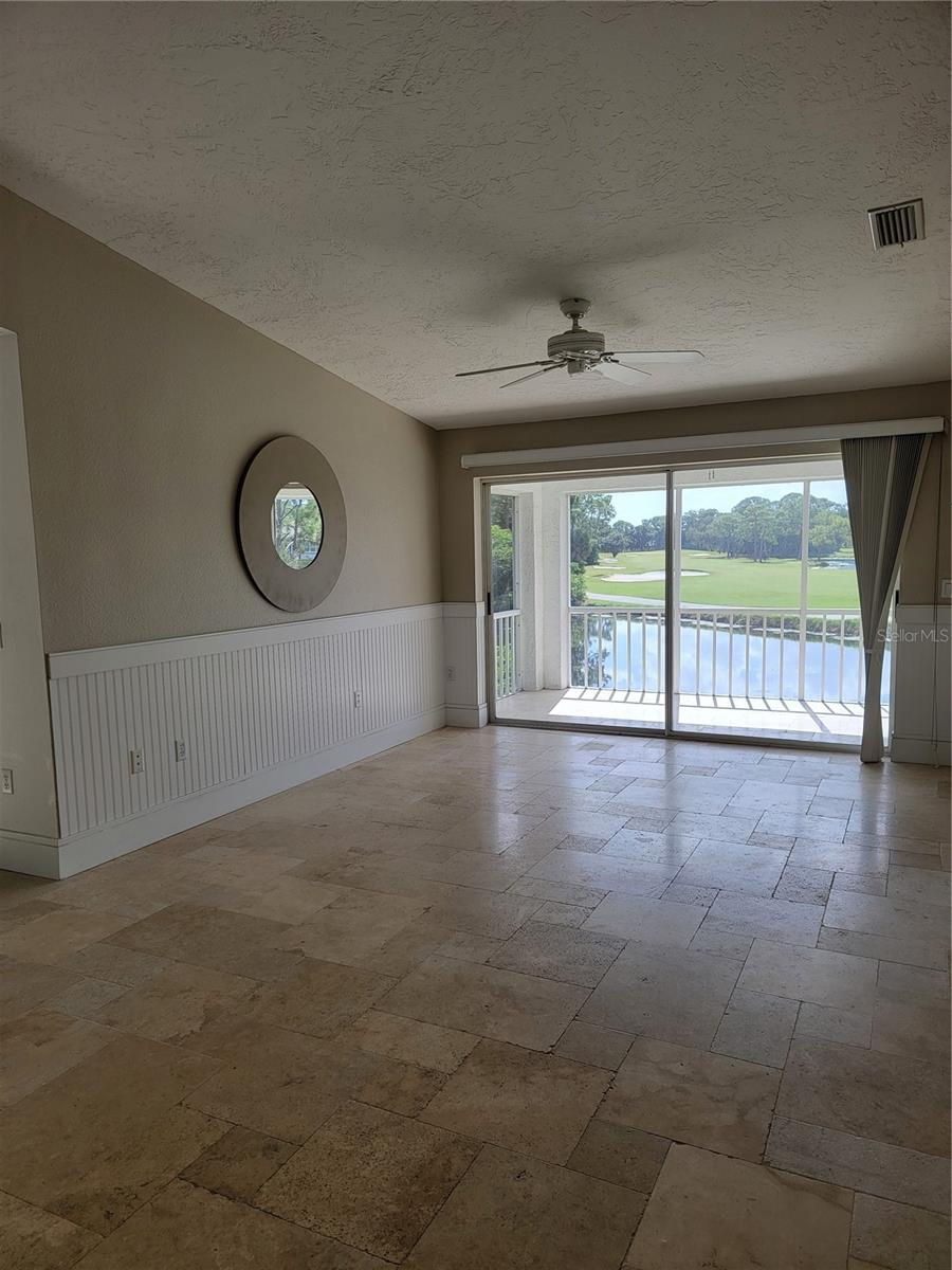 Spacious living room with sliding doors to your balcony - 5654 SHEFFIELD GREENE CIR #28, SARASOTA