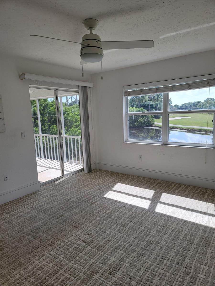 Wake up in the primary bedroom to a peaceful vista - 5654 SHEFFIELD GREENE CIR #28, SARASOTA