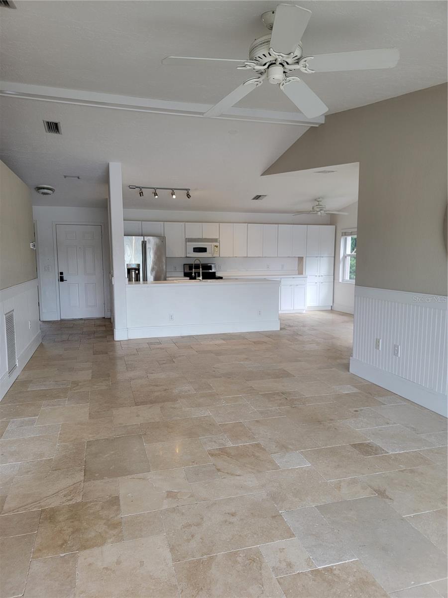 Living room to open plan kitchen - 5654 SHEFFIELD GREENE CIR #28, SARASOTA