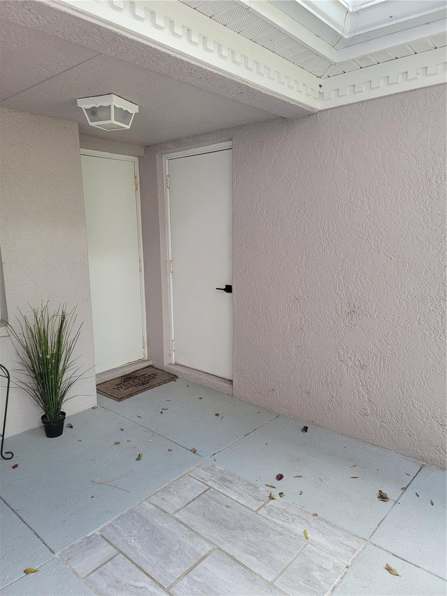 Rear door to garage - 5654 SHEFFIELD GREENE CIR #28, SARASOTA