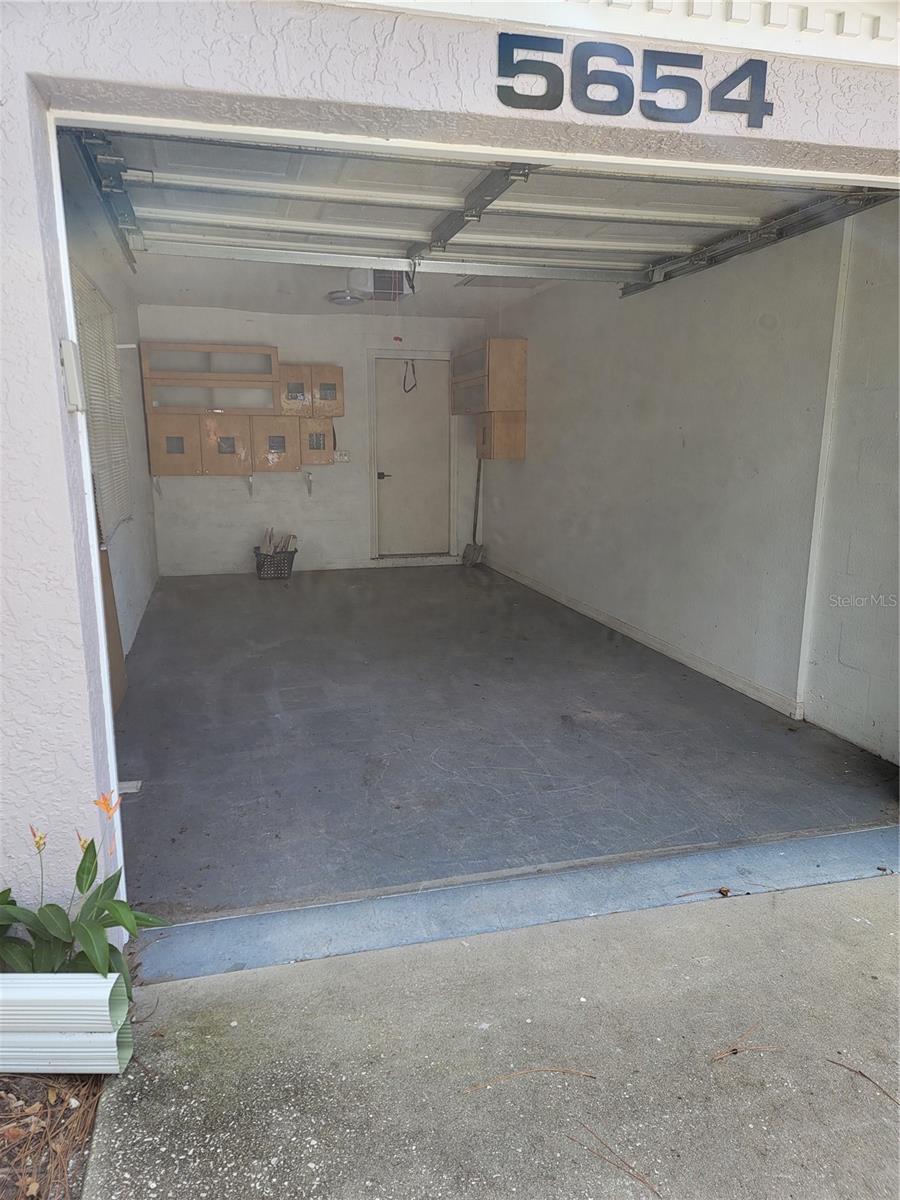 Interior of garage - 5654 SHEFFIELD GREENE CIR #28, SARASOTA
