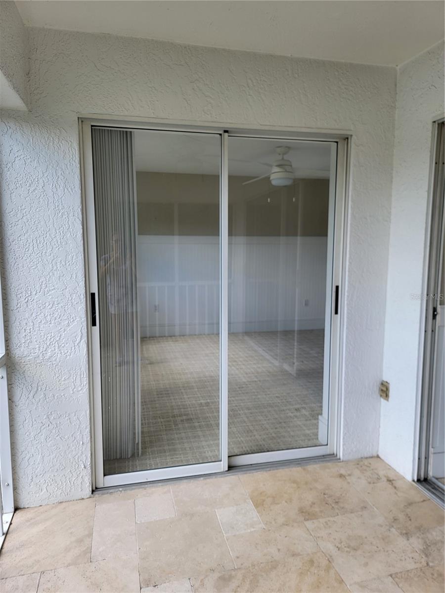 Sliding doors to primary bedroom - 5654 SHEFFIELD GREENE CIR #28, SARASOTA