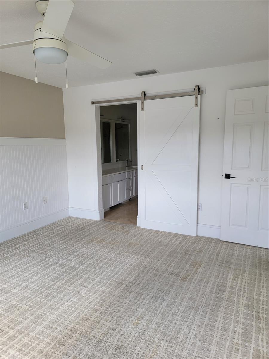 Door from primary bedroom to en-suite - 5654 SHEFFIELD GREENE CIR #28, SARASOTA