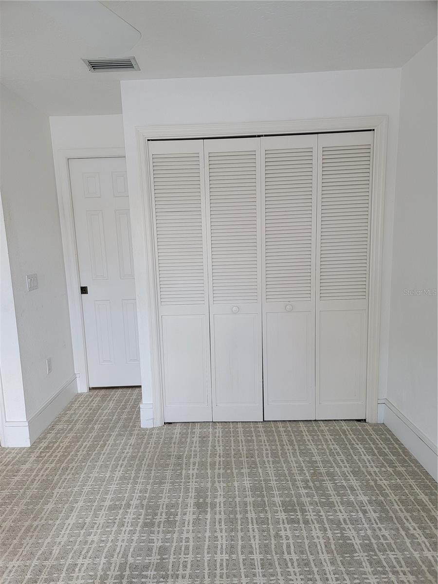 Closet in second bedroom - 5654 SHEFFIELD GREENE CIR #28, SARASOTA
