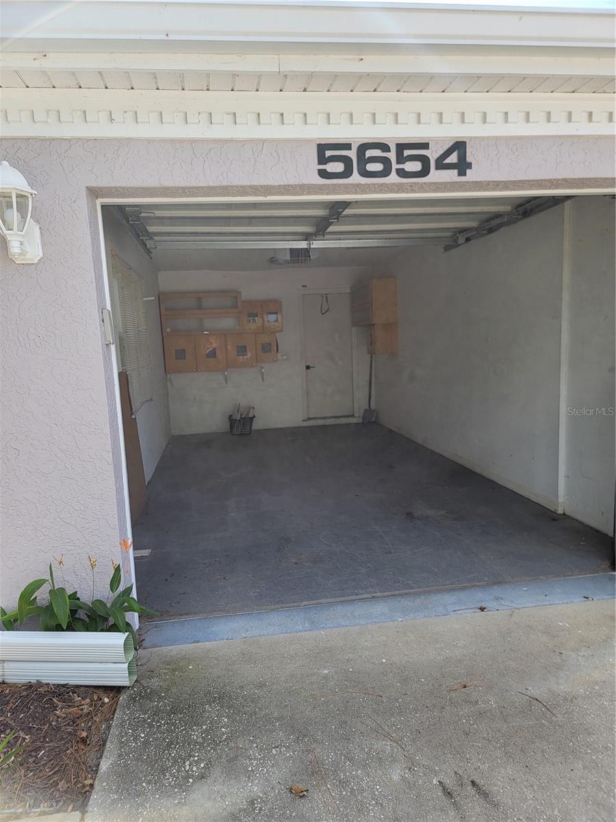 Interior of garage - 5654 SHEFFIELD GREENE CIR #28, SARASOTA
