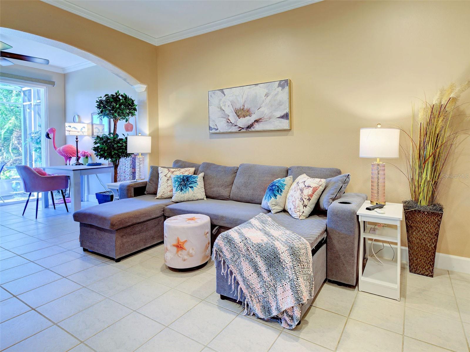 Living Room with extension and attached screened lanai with preserve view. - 668 BACK NINE DR, VENICE