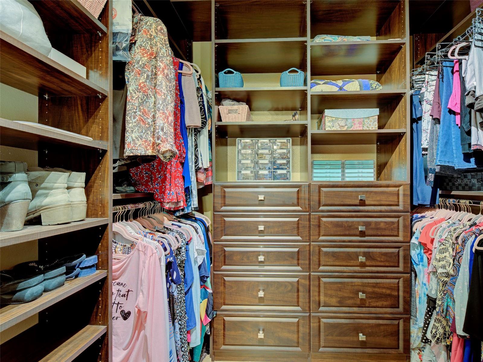 Primary walk-in with custom closet system. - 668 BACK NINE DR, VENICE