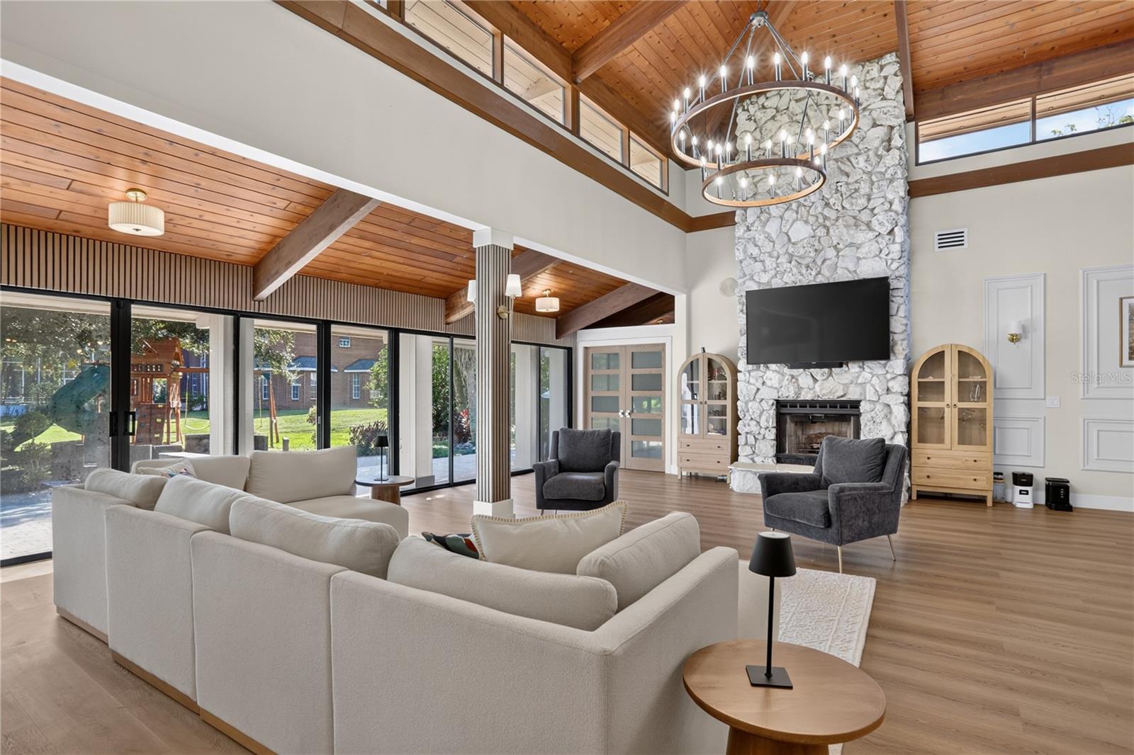 Living room with stoned fireplace - 2313 INDIAN MOUND TRL, KISSIMMEE