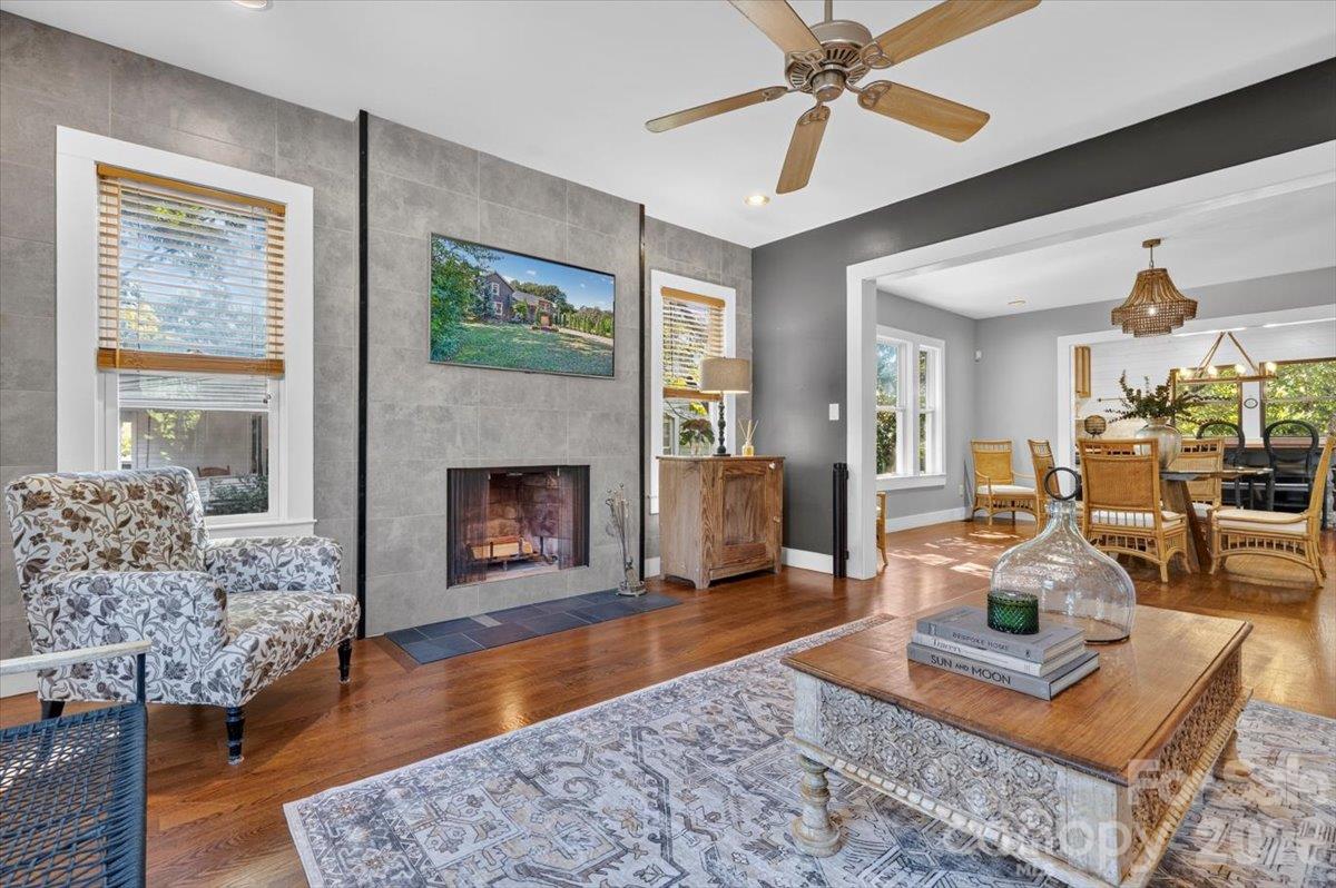 A wood burning fireplace keeps the room cozy while enjoying television. - 521 Forest Lane, Rock Hill