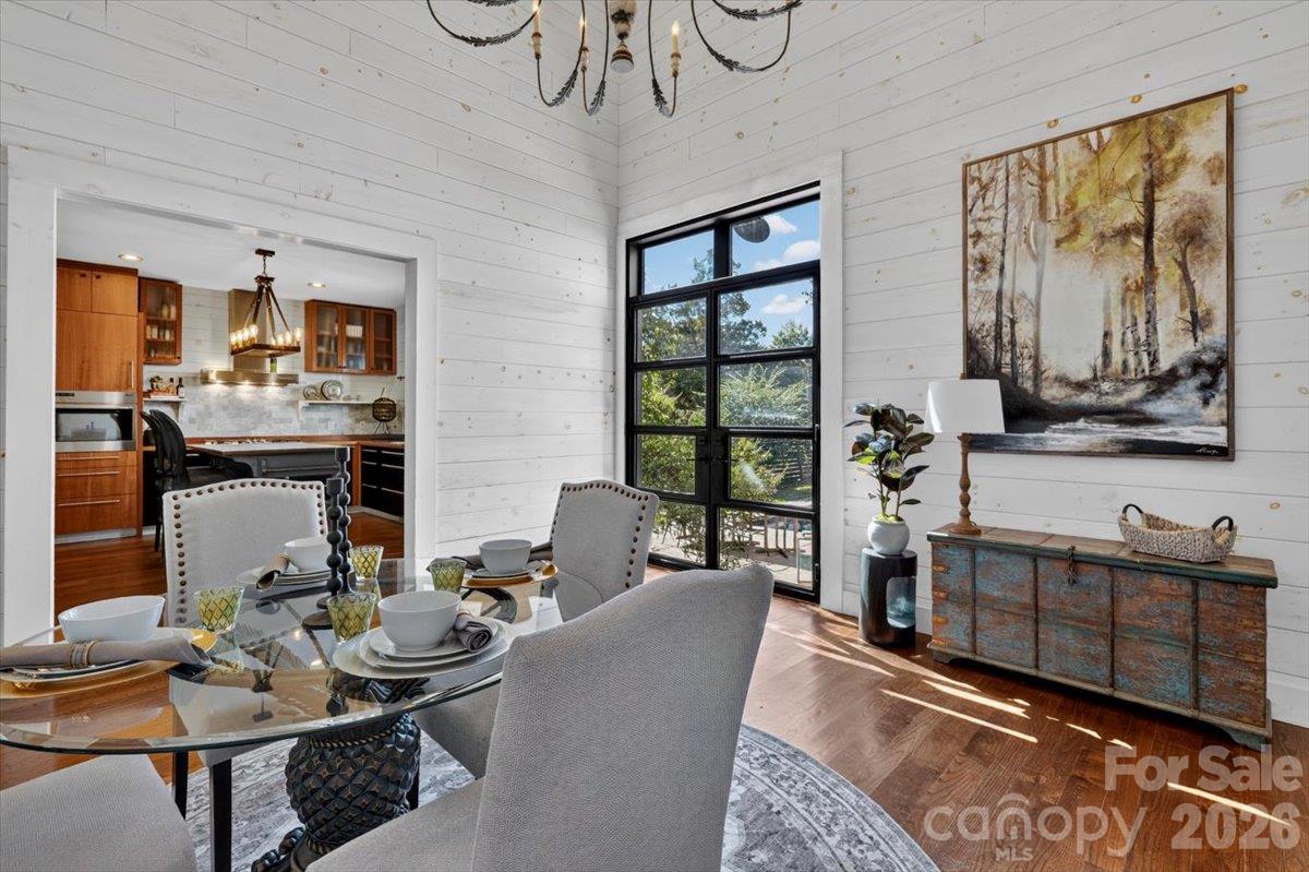 While this room can serve a variety of uses, in this picture, it is a space where the owner can enjoy their breakfast while looking out on the pool and garden. - 521 Forest Lane, Rock Hill
