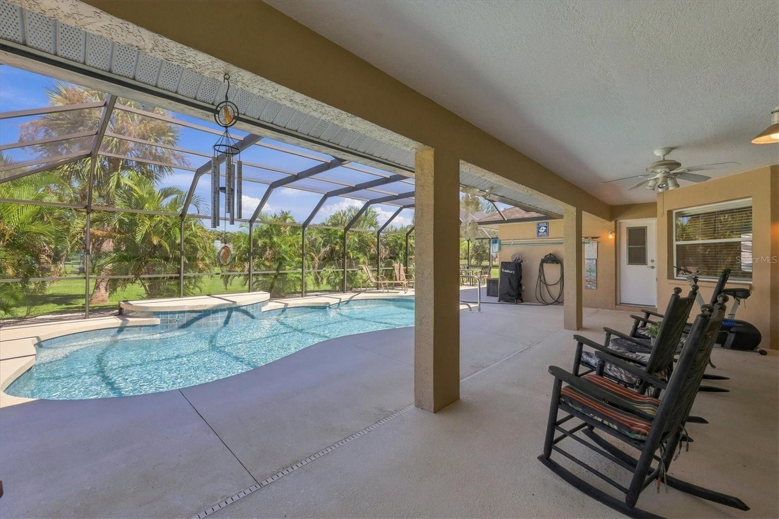 Covered porch area leading out from primary bedroom is approximately 35x15 ft. - 2805 NORWOOD LN, VENICE