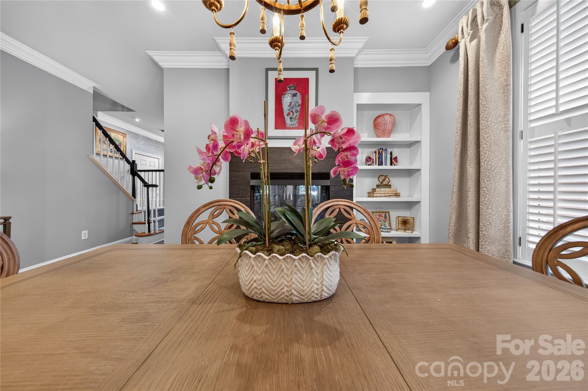Built in bookcase flank see thru fireplace - 9251 Bonnie Briar Circle, Charlotte
