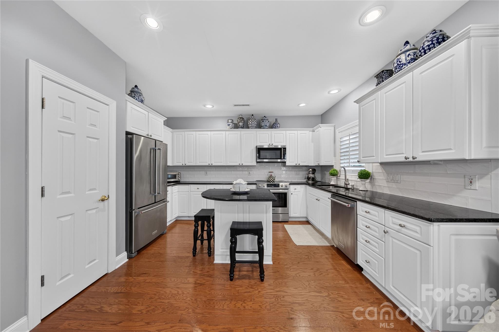 Chef's Kitchen with abundance of cabinetry and center island - 9251 Bonnie Briar Circle, Charlotte