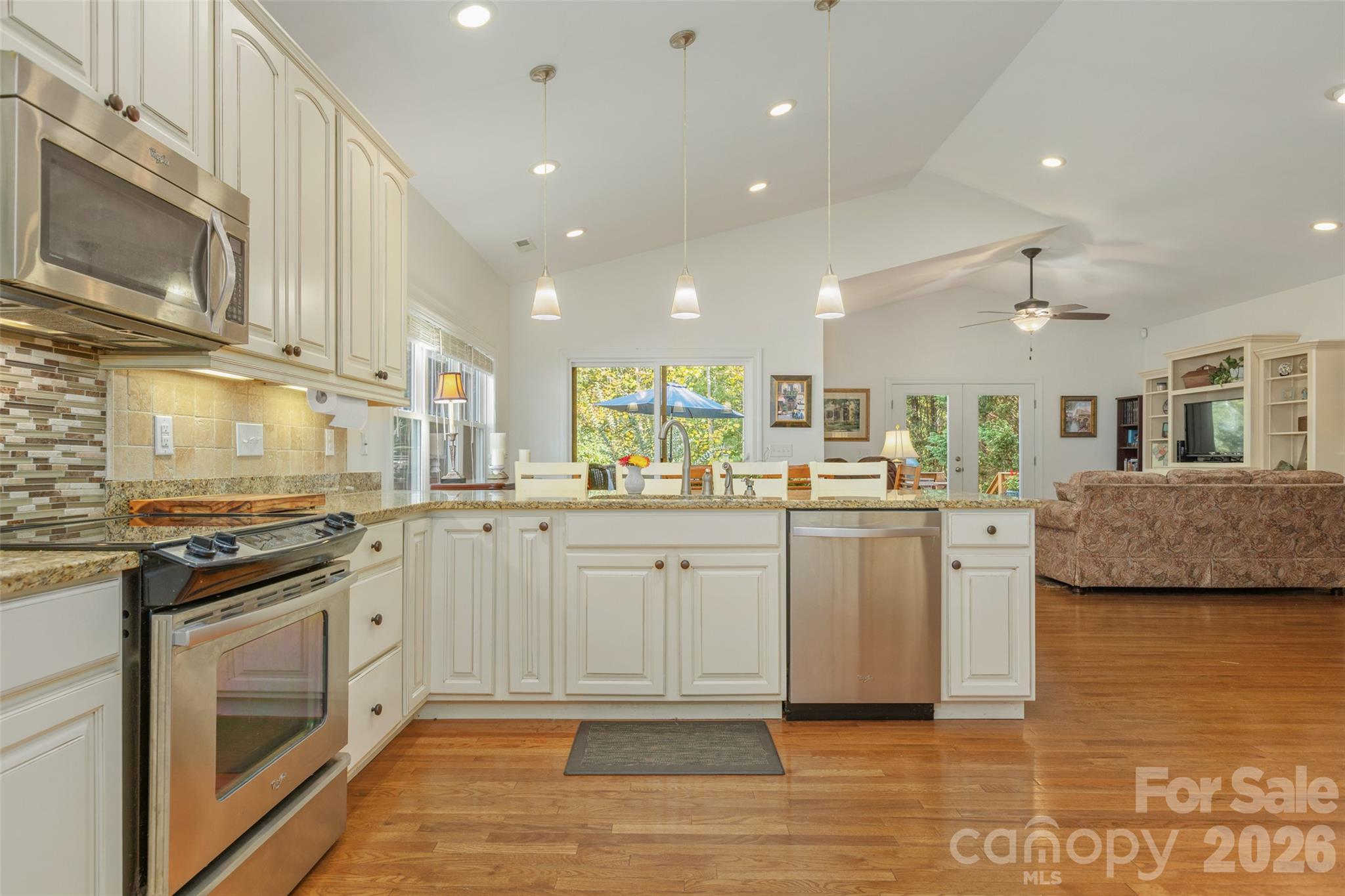 Kitchen opens seamlessly to dining and living area. - 52 Fox Trot Path, Fletcher
